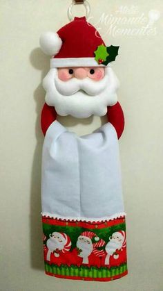 a santa clause ornament hanging on a wall