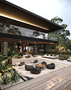 an outdoor living area with couches and tables