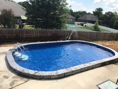 an above ground swimming pool in a backyard