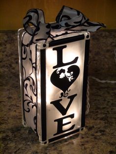 a lighted box with the word love on it