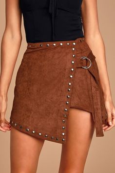 Lulus | Baillie Brown Suede Studded Asymmetrical Wrap Mini Skirt | Size Medium | 100% Polyester | Vegan Friendly Chic Mini Wrap Skirt For Fall, Belted Mini Skort For Fall, Chic Asymmetrical Wrap Skirt For Fall, Chic Asymmetrical Skort For Fall, Lined Mini Wrap Skirt For Fall, Brown Asymmetrical Mini Skirt For Fall, Workwear Mini Wrap Skirt For Fall, Mini Wrap Skirt For Fall Workwear, Fall Mini Wrap Skirt For Workwear