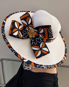 ombines timeless elegance with vibrant cultural flair. Handcrafted with care, this hat features a beautifully woven straw base adorned with bold African print fabric, offering both style and sun protection. Perfect for church services, outdoor events, or simply adding a touch of sophistication to your outfit, this hat blends tradition with modern design. Lightweight and breathable, it's as comfortable as it is striking. Elevate your look with a hat that celebrates heritage and craftsmanship. One size: should fit all. **** The straw hat color might vary from white to Beige. White Toquilla Straw Hat For Kentucky Derby, White Toquilla Straw Hat For Vacation, White Flat Brim Straw Sun Hat, White Straw Sun Hat With Flat Brim, Handmade White Panama Hat With Short Brim, White Adjustable Straw Hat For Kentucky Derby, Adjustable White Straw Hat For Kentucky Derby, White Panama Hat For Vacation At Kentucky Derby, White Handwoven Brimmed Hat