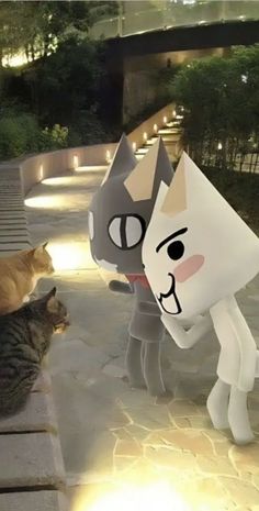 an animated cat is standing next to another cat on the ground in front of a building