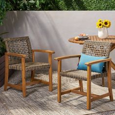 two chairs and a table on a patio