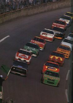 the cars are lined up on the race track to take off from the starting line