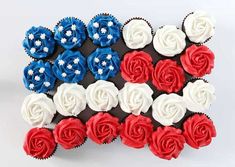 cupcakes with red, white and blue frosting in the shape of an american flag