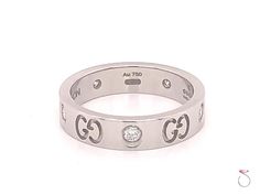 Gucci 5 Diamond Icon Band Ring, 4 mm Wide, 18K White Gold Size 4.50, 0.30 Ctw. Authentic Gucci 5 diamond Icon ring in 18K white gold. This beautiful Gucci Icon ring features 5 Gucci logos seperated by 5 round brilliant diamonds. The diamonds are approximately 0.06 carat each, D to F in color and VVS1 to VS1 in Clariy. The total weight of diamonds on the ring is approximately 0.30 carat. As usual with all Gucci jewelry, the details on this ring are just stunning and the finish is great. The ring Necklace Combos, Intricate Rings, Icon Jewelry, Diamond Icon, Necklace Combo, Vs1 Diamond, Gucci Jewelry, Cute Necklace, Brilliant Diamond