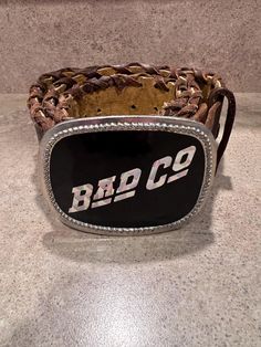 Vintage Bad Co Rock Band Leather Woven Belt and Buckle 1977 Midwestern ORIGINAL Very rare complete belt buckle and woven leather belt from 1977! Belt is approximately 40" long from leather belt tip to end of the belt buckle and 1.75" wide. Message me with any questions. Leather Belt Buckles For Rodeo, Leather Concho Belt Buckles For Rodeo, Leather Belts With Antique Buckle For Rodeo, Rustic Leather Belt Buckles For Rodeo, Western Antique Belt Buckles For Festival, Rustic Concho Belt Buckles For Rodeo, Vintage Leather Belts For Ranch, Southwestern Leather Belt Buckles For Rodeo, Rustic Antique Buckle Belt For Rodeo