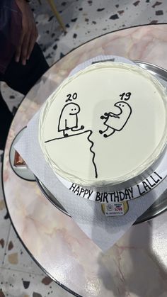 a birthday cake that has been decorated with an image of a man and woman on it