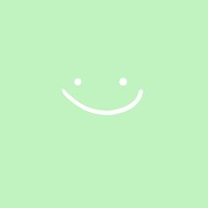 a green background with a smiley face drawn on the front and bottom half of it