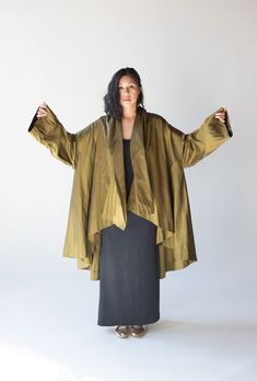 "Olive silk evening jacket by Romeo Gigli from his spectacular SS 1990 collection.  Voluminous high low proportions. Shawl collar that can be tied at the back or left to fall into soft folds.  - Size labeled 44  Shoulder: 28.5\"  Bust: Full  Hips: Full  Length: 27.5\" front / 39\" back  Sleeve Length: 18.5\"  Condition: Excellent! - Small 1/4\" tear at back only noticed when held up to light. It's on a slub in the fabric." Todd Oldham, Evening Coat, Romeo Gigli, Evening Jacket, Evening Jackets, Norma Kamali, Jean Paul Gaultier, Shawl Collar, Vintage Shoes