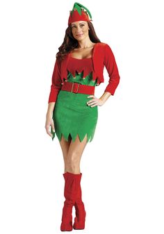 a woman in a green and red christmas elf costume standing with her hands on her hips