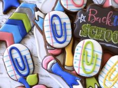 some decorated cookies with writing on them and back to school written on the top one