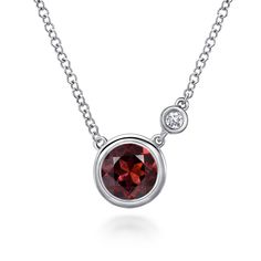 This timeless sterling silver necklace showcases a bezel set round garnet accented by a sensational round accent diamond. Sterling Silver Round Fine Jewelry Necklaces, Sterling Silver Round Necklace Fine Jewelry, Fine Jewelry Sterling Silver Round Necklace, Sterling Silver Round Necklaces Fine Jewelry, Sterling Silver Necklaces With Round Cut Polished Finish, Sterling Silver Necklace With Polished Finish, Formal Sterling Silver Necklace With Round Stone, Classic Necklace With Sterling Silver Round Pendant, Classic Necklace With Round Pendant And Sterling Silver Clasp