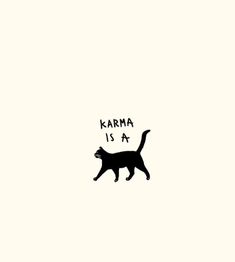 a black cat with the words karma is a on it's back and side