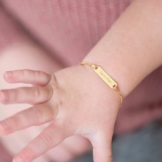 If you're looking for a creative and special gift for toddlers and children, this beautiful, engravable plain rectangular identification tag bracelet is a meaningful gift for any event. Entirely crafted in 14k Yellow Gold, which is safe for babies and children's everyday wear. Order a traditional ID bracelet today and we'll neatly package it into its own lovely gift box. Personalized Yellow Gold Rectangular Name Bracelet, Personalized Rectangular Yellow Gold Name Bracelet, Personalized Rectangular 14k Gold Bracelets, Personalized Rectangular Bracelets As Gifts, Rectangular Engraved Gold Bracelet Gift, Personalized Adjustable Nameplate Gold Bracelet, Personalized Yellow Gold Nameplate Bracelet, Everyday Nameplate Bracelet With Custom Name, Rectangular Yellow Gold Name Bracelet