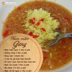 a bowl filled with rice and soup next to a wooden sign that says nice main ganga