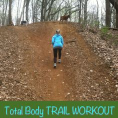 a woman walking down a trail in the woods with text overlay that reads total body trail workout