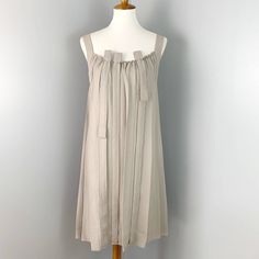 Excellent Pre-Owned Condition! Spring Sleeveless Silk Midi Dress, Knee-length Daywear Dress With Tie Straps, Beige Sleeveless Mini Dress With Tie Straps, Knee-length Dress With Tie Straps For Daywear, Sleeveless Silk Dress With Tie Straps, Sleeveless Linen Dress With Ruffles, Sleeveless Beige Mini Dress For Daywear, Beige Sleeveless Mini Dress For Daywear, Spring Silk Dress With Tie Straps