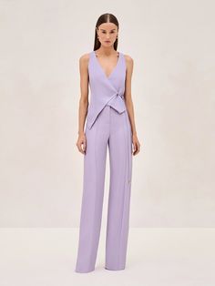 Experience the elegance of simplicity with the Cain Vest. Featuring a deep V-neckline and a wrap silhouette, secured by a side tie that emphasizes the waist. Paired perfectly with the Rex Pant, this duo will be your go to this summer. H Silhouette Fashion, Modern Pantsuit Women, Summer Suit Women Wedding, Cocktail Attire Women Pants, Women’s Business Formal, T Silhouette Fashion, Servers Outfit, Pant Dresses For Women, Fun Formal Outfits