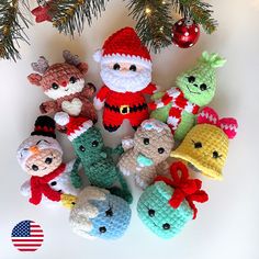 crocheted christmas ornaments are arranged on a table