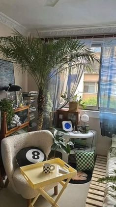 a living room filled with furniture and plants