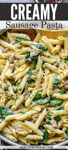 creamy sausage pasta with spinach in a pan