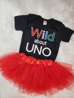 Wild about UNO Glitter Bodysuit Tutu NOT included IF YOU DO NOT SEE A SIZE YOU NEED PLEASE MESSAGE ME AND I WILL TRY TO ACCOMMODATE YOUR ORDER. WHAT YOU WILL RECEIVE:  ♥  as described in the example photo above.  HOW TO ORDER:  ♥ Choose your size  ♥ Add to cart. ♥ Please include any special instructions in the notes to seller box at checkout.  CARE INSTRUCTIONS: All of my products are made with a high quality heat transfer vinyl then pressed with a professional heat press, ensuring the vinyl will not flake or peel when washed. ♥ Turn inside out ♥ Machine wash cold on delicate cycle/handwash ♥ Tumble dry on low heat ♥ Do not bleach/dry-clean ♥ Do not iron directly onto the design. IMPORTANT INFORMATION: ♥ If you do not see a size you need, please message me directly.  ♥ Everythinglovely822 Uno Birthday Party, Uno Birthday, Glitter Bodysuit, First Birthday Shirts, Turning One, First Birthday Party, Gender Neutral Baby, Transfer Vinyl, Heat Transfer Vinyl