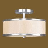 a light fixture with a beige shade on the bottom and a white drum in the middle