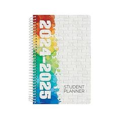 a spiral notebook with the words 2013 - 2016 written in white and rainbow on it