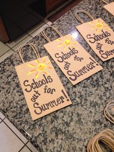 three tags that say school is out for summer on a granite countertop next to an oven