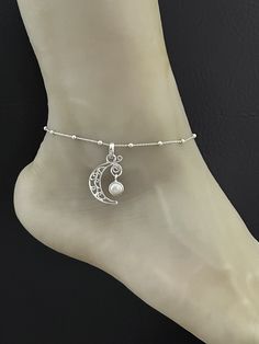 "Genuine Mother Of Pearl Anklet Sterling Silver Celestial Moon Anklet Minimalist and Dainty Rolo Beaded Celtic Charm Anklet ANKLET FEATURES: Metal:  All components are made from solid .925 Sterling Silver  Model is wearing 10\" in length  solid .925 Sterling Silver Rolo Bead Chain Chain Length:  9 inch + 1 inch extension  Charm Measurements:  Genuine Mother Of Pearl Crescent Pendant Height: 35mm, including bail Width: 21mm Your Dainty Rolo Beaded Celtic Charm Anklet will arrive in a gift box, be Adjustable Sterling Silver Anklets For Wedding, Adjustable Sterling Silver Wedding Anklets, Dainty White Wedding Anklets, Crescent Pendant, Wedding Anklets, Beaded Ankle Bracelets, Charm Anklet, Silver Model, Beaded Ankle