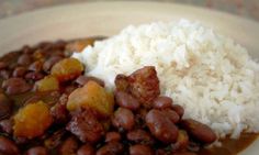 a white plate topped with beans and rice