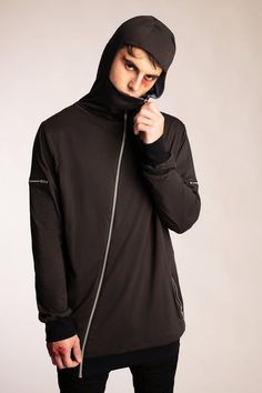 ► GARMENT ◄- Relaxed fit hoodie- High neck that covers the nose and mouth when fully zipped- Asymmetrical front zip- 2 zip pockets at waist- 2 mini zip pockets at bicep- Fully lined in either dusty blue or stone- Charcoal gray body with black cuffs and hem- Fitted hood► FABRIC ◄This garment is made from 100% organic cotton. This impeccably soft and comfortable organic cotton jersey is GOTS certified. Because real style goes beyond what you wear.► CARE ◄Our garments are made utilizing unique dye Casual Black Hooded Jacket With Zip Cuffs, Long Sleeve Hoodie With Double-lined Hood For Layering, Urban Hooded Jacket With Zipper Closure, Urban Long Sleeve Hooded Jacket With Zipper, Black Hooded Jacket With Zip Cuffs, Long Sleeve Hoodie With Ykk Zipper For Fall, Fall Hooded Jacket With Zip Fly And Long Sleeves, Fall Long Sleeve Hoodie With Ykk Zipper, Urban Winter Outerwear With Asymmetrical Zip