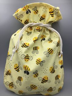 a drawsack bag with bees on it