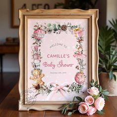 a baby shower sign with pink flowers and teddy bears