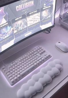 a computer keyboard sitting on top of a white desk next to a mouse and monitor