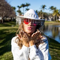 Gather your bridal party and get ready for some fun with our Bride Cowboy Hat with Pearls! This unique and stylish hat is the perfect accessory for any bachelorette party or bridal shower, ensuring the bride-to-be stands out. Features: Chic cowboy hat adorned with elegant pearlsComfortable fit for all-day wearIdeal for bachelorette parties, bridal showers, and bridesmaids proposalsThis hat is a great way to add a touch of western flair to your celebrations. Whether you’re hitting the town with your bridesmaids or having a themed bridal shower, this cowboy hat makes a fantastic statement. It also serves as a fun and memorable addition to bridesmaid gifts, making sure everyone can join in the excitement. Complete your bridal party look with our Bride Cowboy Hat with Pearls—the perfect access White Fedora Costume Hat For Party, White Fedora Mini Hat For Party, Adjustable White Mini Hats For Bachelorette Party, White Adjustable Hat For Bachelorette Party, Bride Cowboy Hat, Hat With Pearls, Mens Pjs, Themed Bridal Shower, Kids Robes