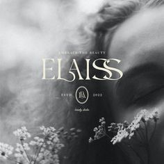 a woman's face with her eyes closed and the words elais above it