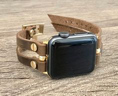 Gold Apple Watch Band 38mm 40mm 42mm 44mm. Double Strapped 7mm Rustic Brown Leather Straps with Adjustable Buckles. Gorgeous Design Bracelet Tailored to Perfection. Designed And Handmade by Simeon D Jewelry Studio. This Bracelet Fits ALL Apple Watch Series. Please Measure Your Wrist Before Submitting Your Order! Not For Other Models. Apple Watch Is NOT Included. Let's be Friends! Follow my Studio on Social Media Instagram @simeondjewelry Pinterest @simeondjewelry Facebook @simeondjewelrystudio Gold Apple Watch Band For Everyday Use, Brown Waxed Apple Watch Band For Everyday, Gold Rectangular Apple Watch Band With Leather Strap, Adjustable Gold Leather Watch Bands, Gold Rectangular Leather Apple Watch Band, Gold Leather Apple Watch Band With Bracelet Strap, Gold Leather Apple Watch Band, Gold Leather Watch Strap, Gold Leather Wrist Strap For Watches