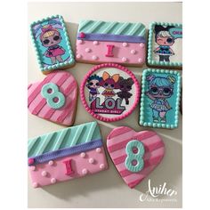 decorated cookies are arranged in the shape of littlest pet shop characters and numbers on them