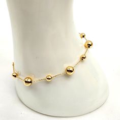 18k Yellow Gold Bubble Bracelet Size 6.5" To 7" In Au750 Cute Real Gold Beads Hollow New Without Tags Spaced Out Bubble Beads Bracelet Station Fits 6.5 To 7 Inches Lightweight Approx 1.7 To 1.8g Bubble Bracelet Stamped Au750 750 18k Pawnable Unbranded Jewelry #Vca #Vancleef #Chanel #Gucci #Cartier #Bvlgari #Ysl #Louisvuitton #Robertocoin #Finejewelry #Japangold #Fashion #Luxury #Fendi #Versace #Tiffany #Botegga #Saudigold #Hongkonggold #Italygold #Tiffanyandco #Dior #Ysl #Alhambra #Vancleefandar Elegant Yellow Chain Bracelet With Jubilee Style, Elegant Yellow Gold Bracelet Gift, Elegant Yellow Gold Jubilee Bracelet, Bracelet Station, Bubble Bracelet, Bubble Beads, Fendi Versace, Pandora Charms Disney, Big Bubble