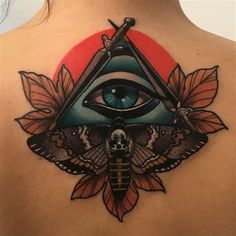 a woman's back with an all seeing eye tattoo on her upper arm and chest