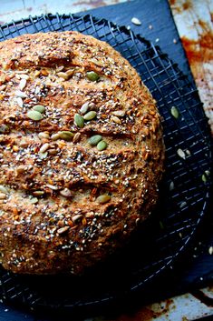 a loaf of bread sitting on top of a cooling rack