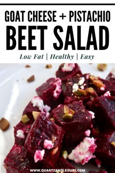 beet salad with goat cheese and pistachio on top, served in a white bowl