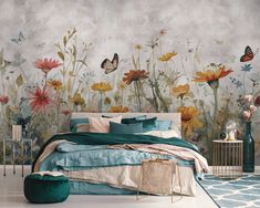 a bedroom with flowers and butterflies painted on the wall