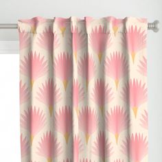 a pink and yellow curtain hanging on the side of a window sill in front of a white wall