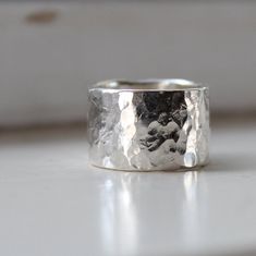 PLEASE NOTE: Personalized and customized orders are not returnable, exchangeable, or refundable. Fabrics that have been cut to order are not returnable. ***Rustic wide and heavy silver ring. It's sterling silver. I designed this for myself because I wanted a simple, rustic, thicker wide band to wear on my index finger. But this ring is truly unisex - perfectly simple minimal style for a man or woman. The ring is a full 1/2" wide and 1.25mm thick. It's intricately hammered to enhance the reflecti Index Finger, Tampa Fl, Minimal Style, Wide Bands, Minimal Fashion, Silver Ring, A Man, Jewelry Accessories, Silver Rings