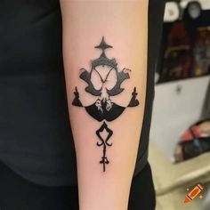 a person with a tattoo on their arm that has an image of a boat and anchor