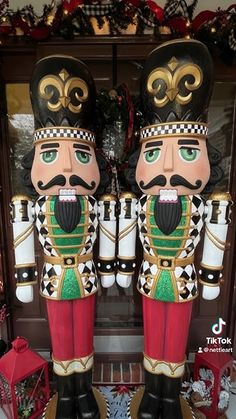 two large nutcrackers are standing next to each other